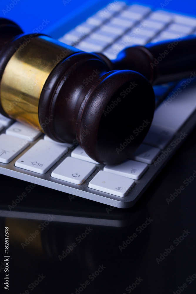 Wooden law gawel close up on computer keyboard, internet auction concept