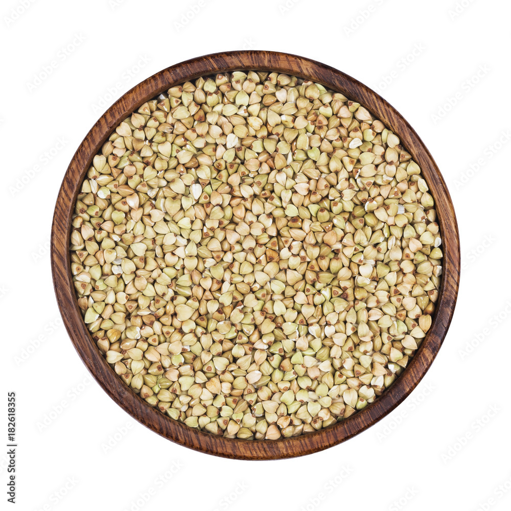 Green buckwheat in wooden bowl isolated on white background. Top view Green buckwheat in wooden bowl isolated on white background. Top view