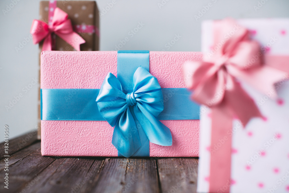 Exclusive gift boxes on a wooden table. Exclusive gift boxes on a wooden table.