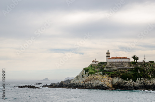 With a turquoise water in front the Lighthouse of Cudillero in Asturias is one of the most beautiful places in the North of Spain © Juan Carlos Alonso