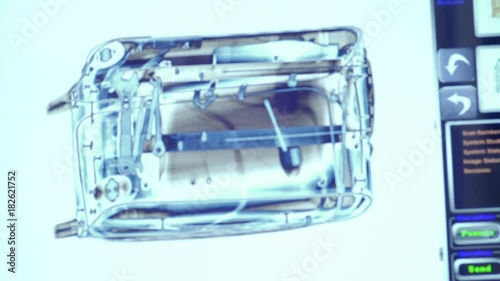 Baggage is scanned in x-ray scanner. Operator change the modes of the scanner.