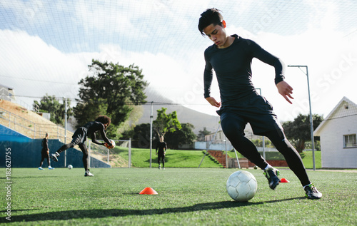 Slika na platnu Soccer player practicing ball control