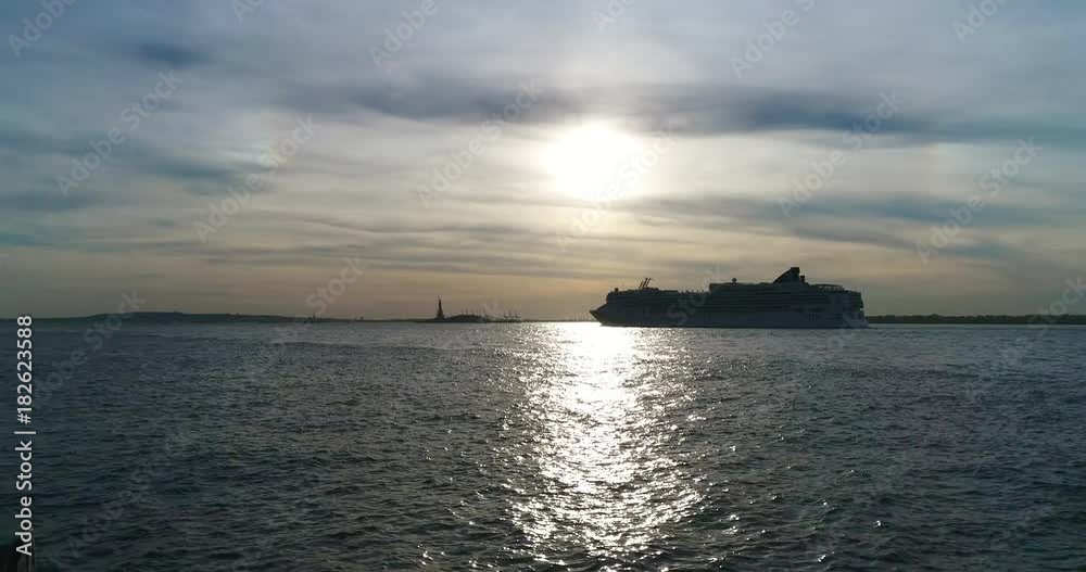 NEW YORK, NEW YORK/USA - OCTOBER, 22, 2017: tourist ferry departing on the sunset NEW YORK, NEW YORK/USA - OCTOBER, 22, 2017: tourist ferry departing on the sunset