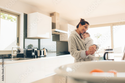 Mother making food for her son in kitchen