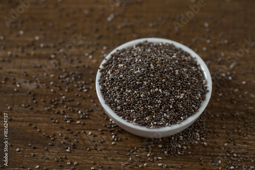 Chia seeds on dark wooden surface