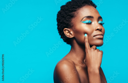 African female model with vibrant makeup photo