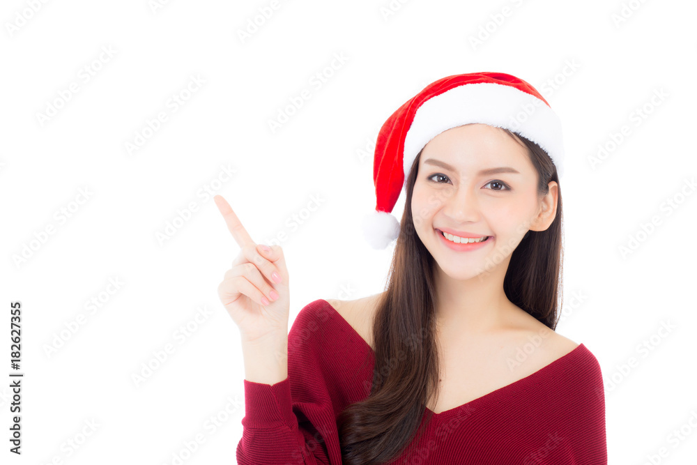 Portrait of beautiful asian young woman pointing something in santa hat smile and happy, girl model isolated on white background, christmas and holiday concept. Portrait of beautiful asian young woman pointing something in santa hat smile and happy, girl model isolated on white background, christmas and holiday concept.