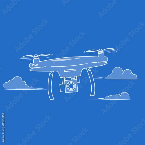 Flying drone with a camera in the sky among the clouds