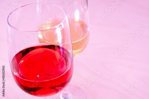 Two glasses with white and red wine