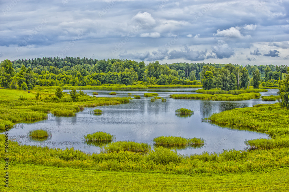 Travel Concepts and Ideas. Belarussian National Park Braslav Lakes Surrounded by Densely Forested Area at Noon During Summertime. Travel Concepts and Ideas. Belarussian National Park Braslav Lakes Surrounded by Densely Forested Area at Noon During Summertime.
