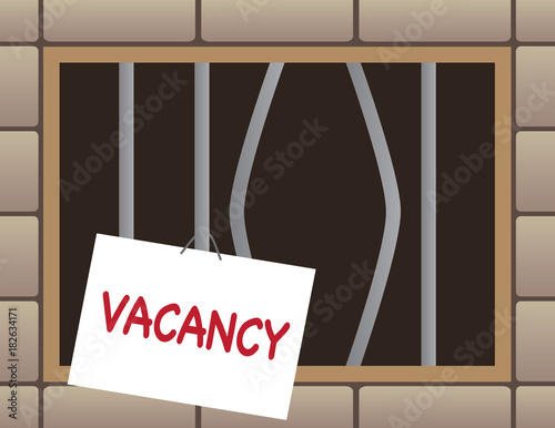 Jail cell window has bent bars and a vacancy sign