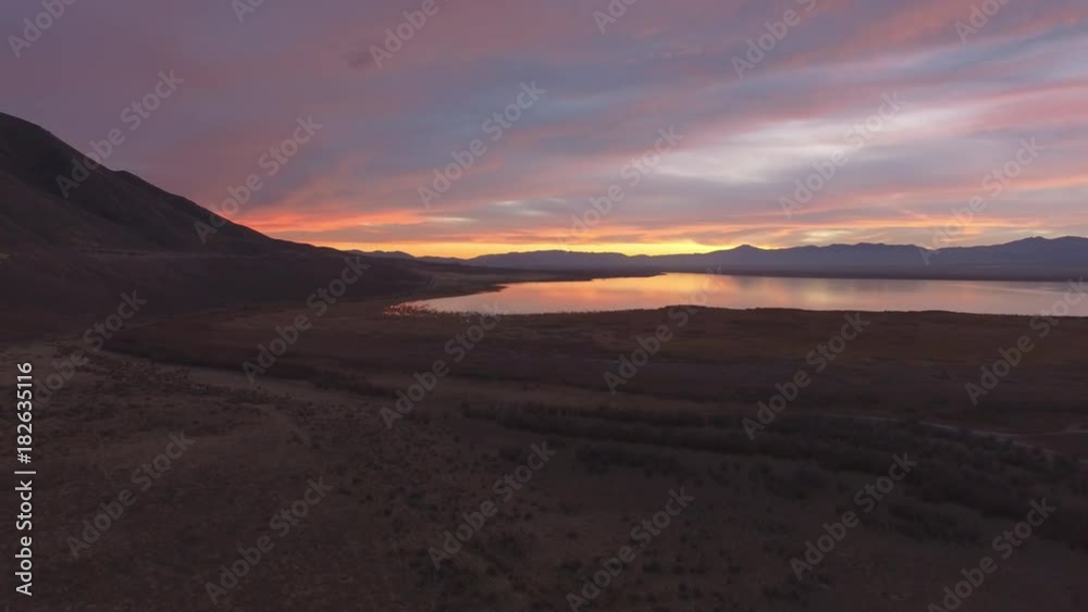 View of colorful sunset from the sky slowly moving down towards the ground. View of colorful sunset from the sky slowly moving down towards the ground.
