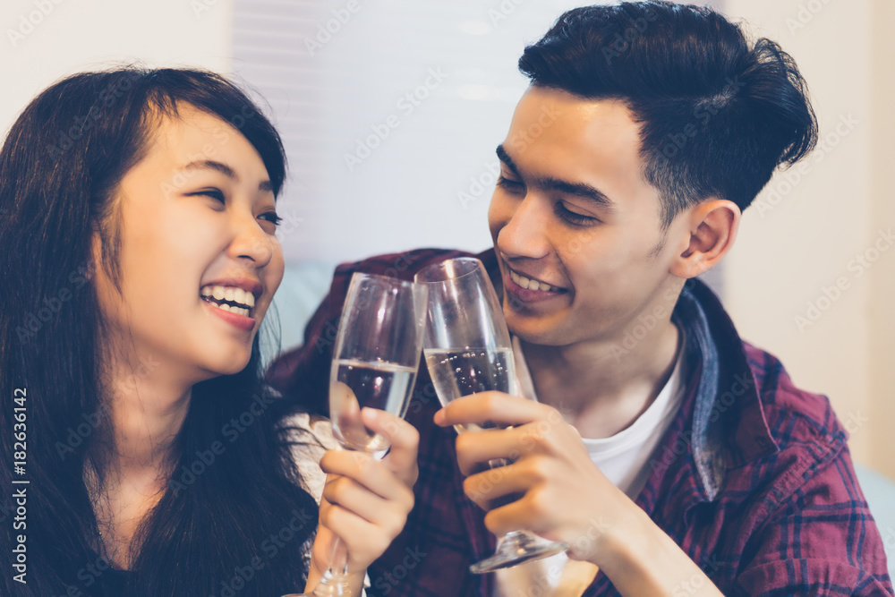 Asian group of friends having party with alcoholic beer drinks and Young people enjoying at a bar toasting cocktails.soft focus