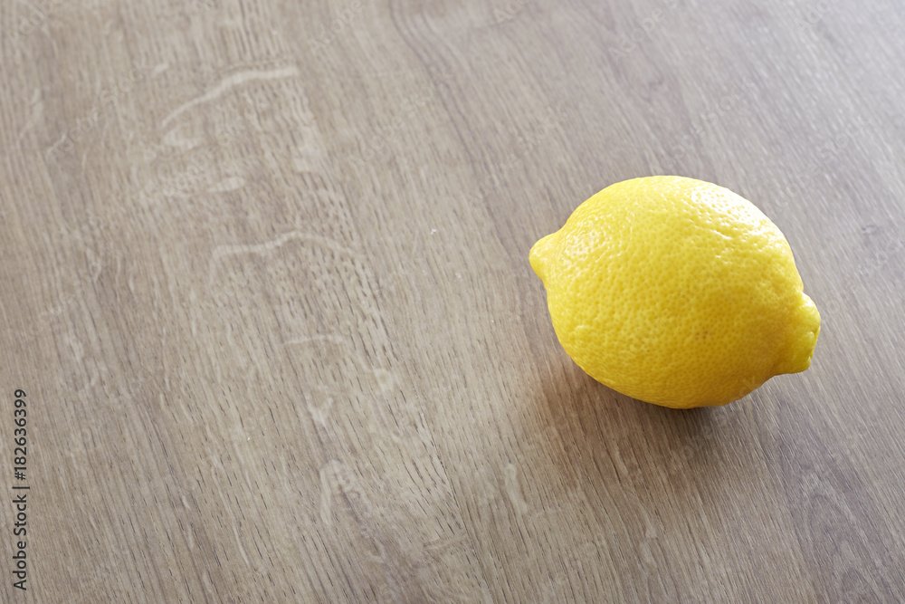 Lemon on wooden background