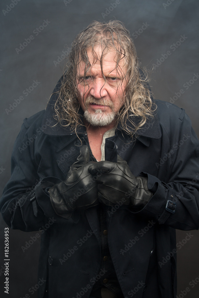 Obraz premium Older man in cold fog with long coat. Cyberpunk theme.