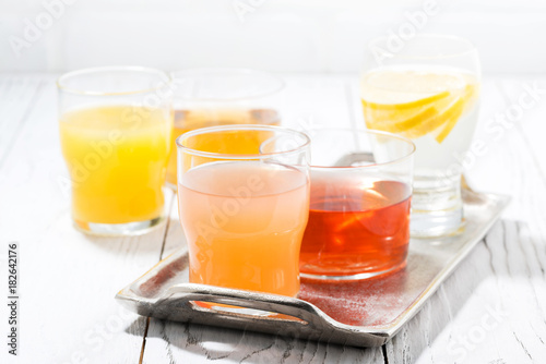 Fototapeta Naklejka Na Ścianę i Meble -  fresh citrus juices in glasses