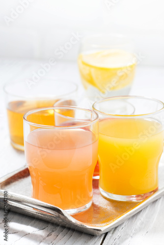 fresh citrus juices in assortment, vertical
