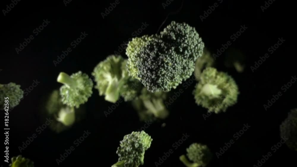 Green broccoli florets. broccoli on a black background