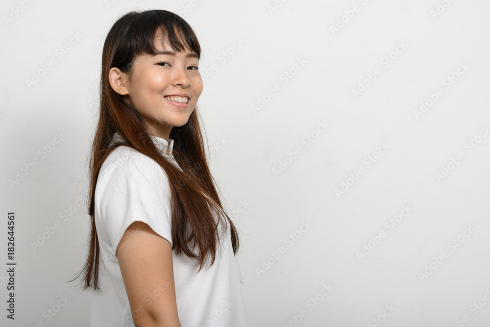 Portrait of beautiful Asian woman against white background Portrait of beautiful Asian woman against white background