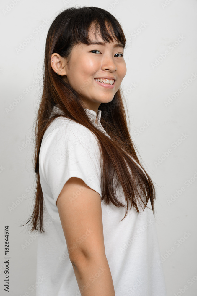 Portrait of beautiful Asian woman against white background Portrait of beautiful Asian woman against white background