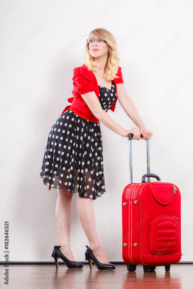 Elegant fashion woman with red suitcase Elegant fashion woman with red suitcase