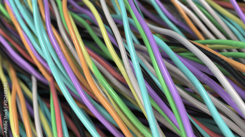 Twisted multicolored cables and wires on black surface