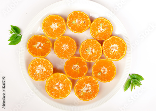fresh orange with green lea isolate on white background