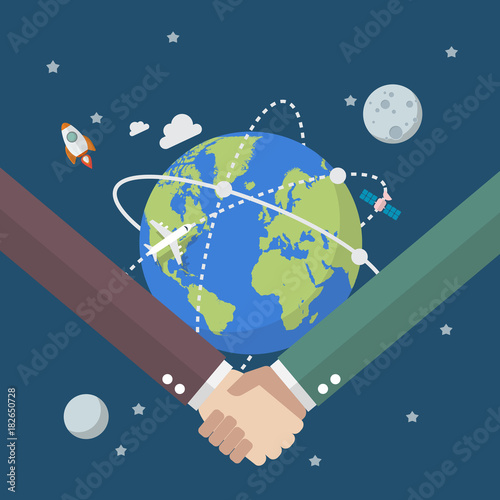 Business people shaking hands on globe