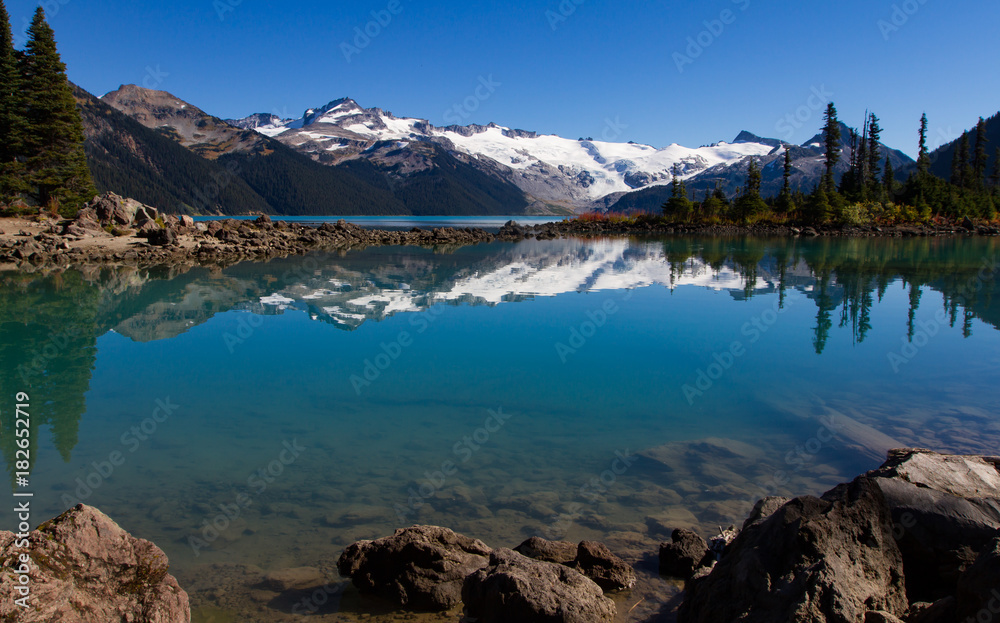 Scenic landscape view of Garibaldi lake provincial park in British Columbia in the summer month with glaciers and snowfields in the distance