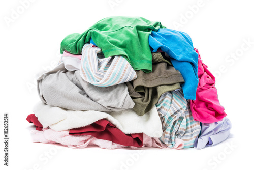 Big heap of colorful clothes isolated on white background