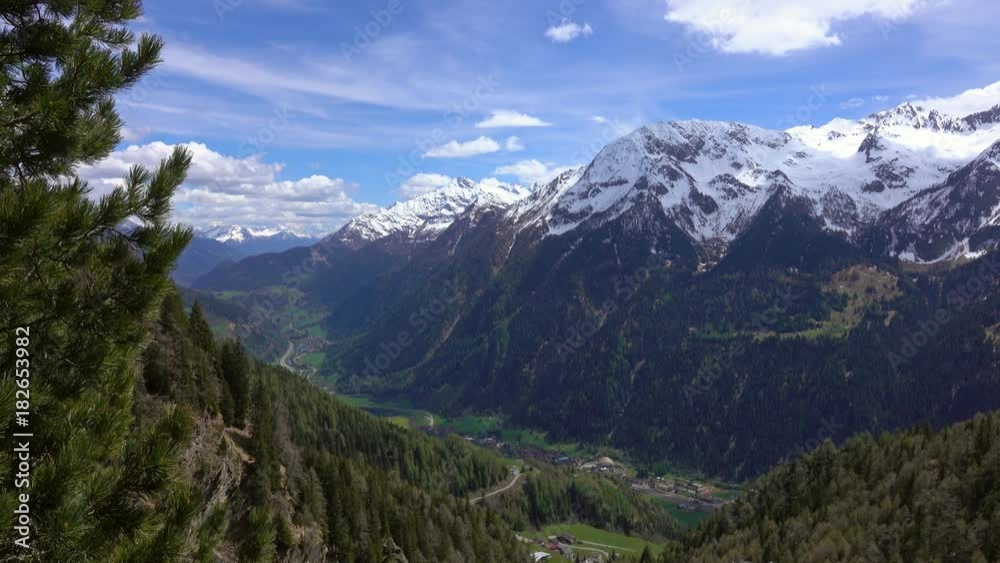 Beautiful top view of high snow-covered mountains and valley with road and village in Switzerland, 4k
Beautiful top view of high snow-covered mountains and valley with road and village in Switzerland, 4k