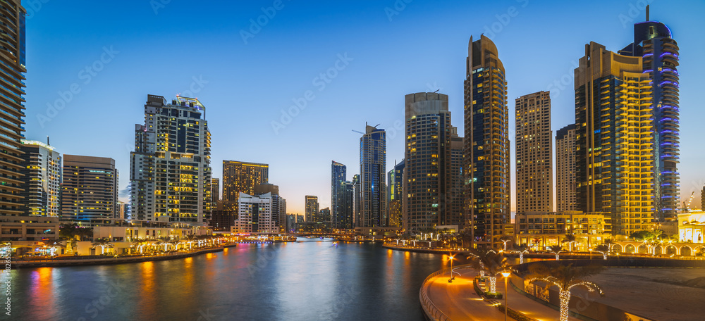 Obraz premium beautiful buildings near marina sun set
