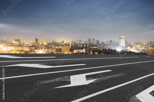 Photography blur emtpy asphalt road and cityscape of shanghai in blue cloud sky at twilight