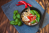 Vegetarian vietnamese style soup pho with garnishes. Traditional asian cuisine.