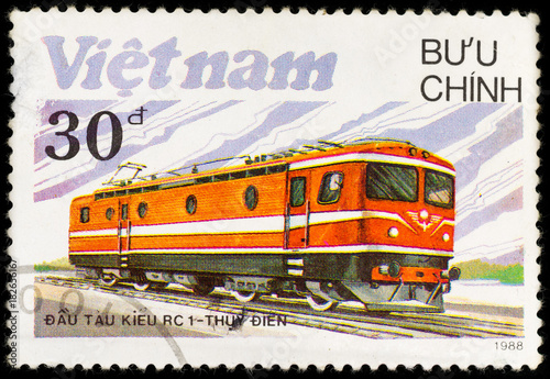 Old vintage postage stamp soviet locomotive and railway, printed in Vietnam in 1988