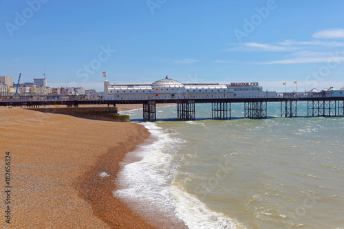 Brighton pier, green sea and the pebble beach