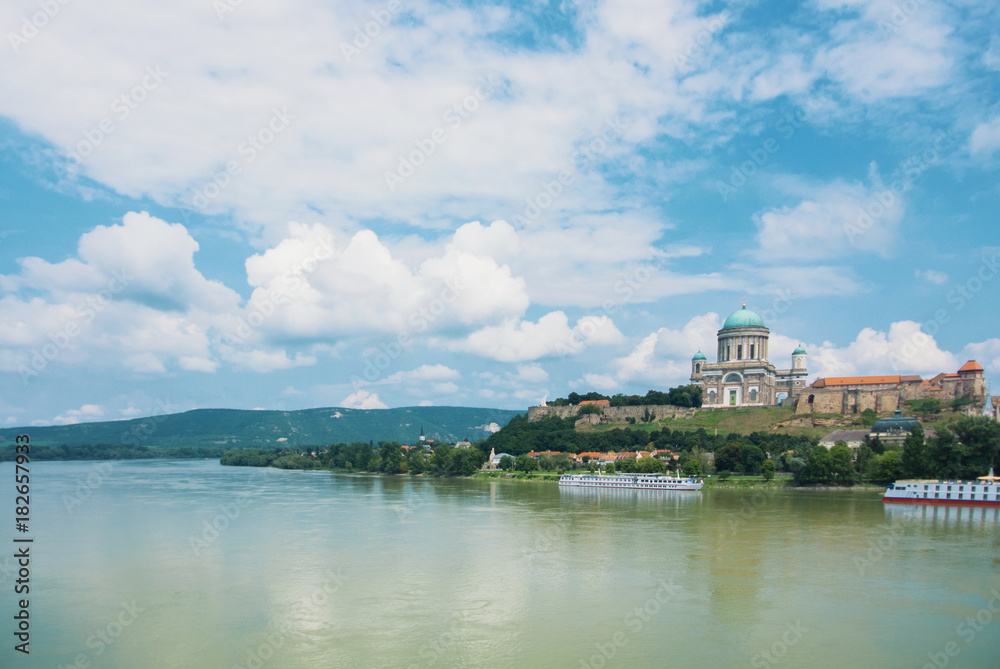 Panoramic aerial view over Danube river to of Esztergom Cathedral Basilica over the hill.