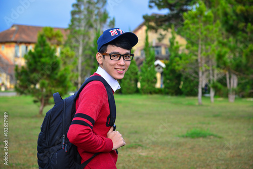 Cheerful Asian young man student