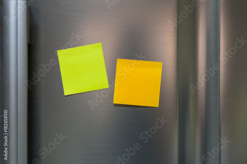 Empty paper sticky note on refrigerator door