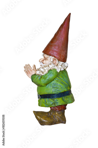 Gnome with red hat and green suit in side angle view/Gnome in green suit and red pointed hat in side view with hands together