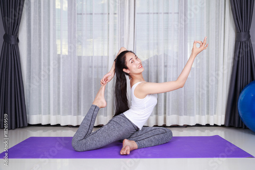 woman doing yoga exercise isolated on white background