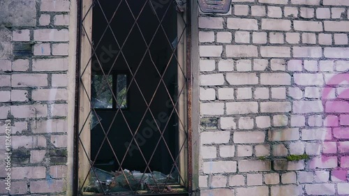 alone homeles searches something in abandoned building photo