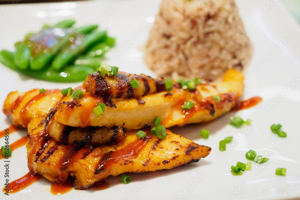Grilled chicken steak with spicy sauce and rice Grilled chicken steak with spicy sauce and rice