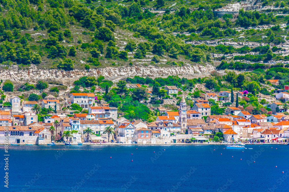 VIs coastal town landscape. / Seafront picturesque view at coastal town Vis in Croatia, popular summer travel destination.