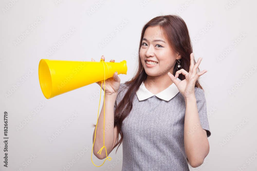 Beautiful young Asian woman show OK announce with megaphone. Beautiful young Asian woman show OK announce with megaphone.