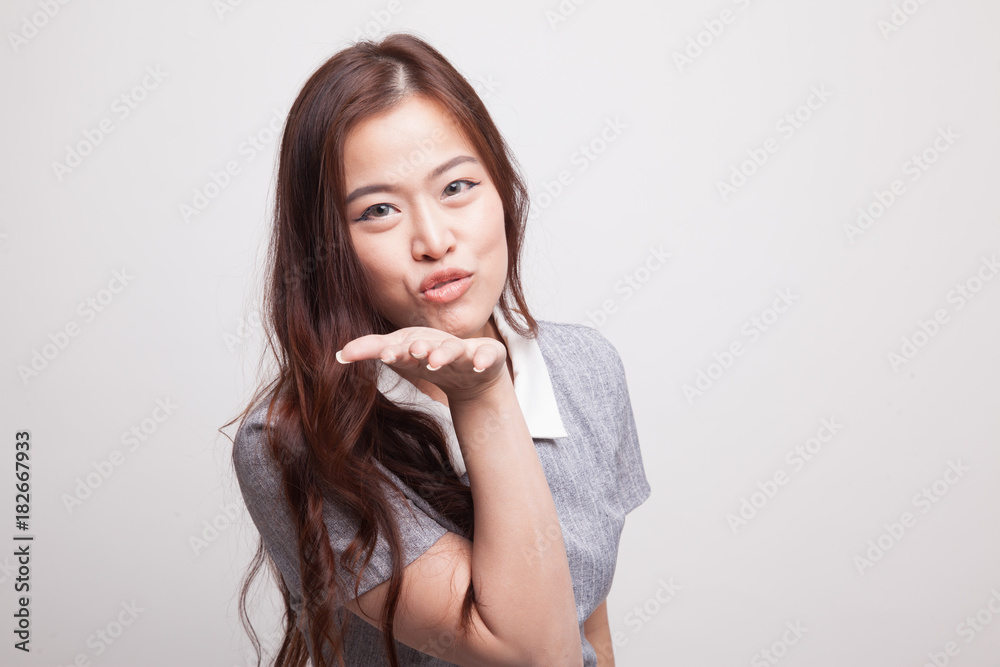 Beautiful young Asian woman blow a kiss. Beautiful young Asian woman blow a kiss.