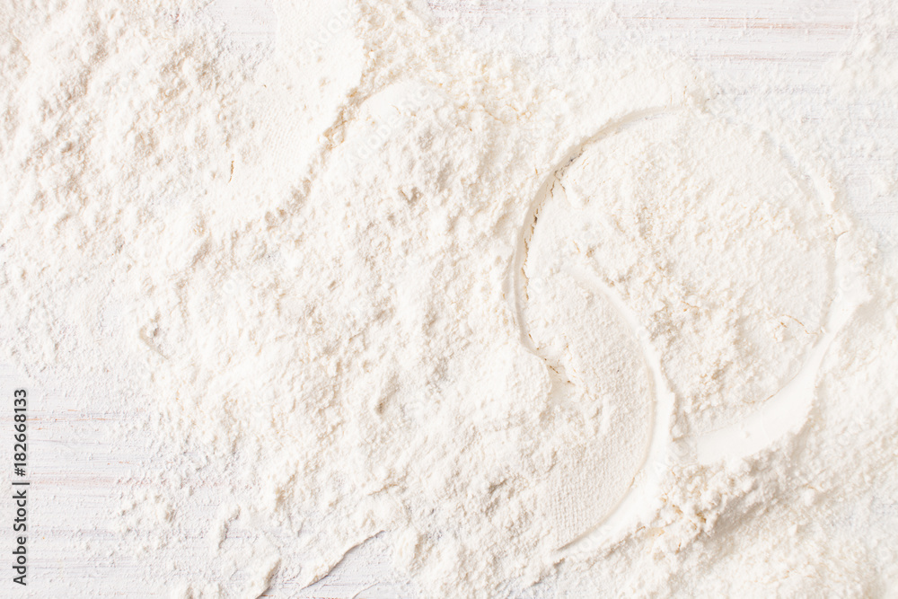 The background image is a flour on a white table. View with copy space The background image is a flour on a white table. View with copy space