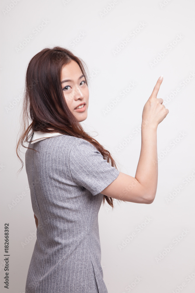 Back of Asian woman touching the screen with her finger. Back of Asian woman touching the screen with her finger.