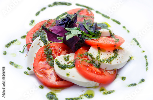 salad with caprese on white background