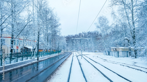 Photography White snow in the city on a tramway in November, the first snow in December